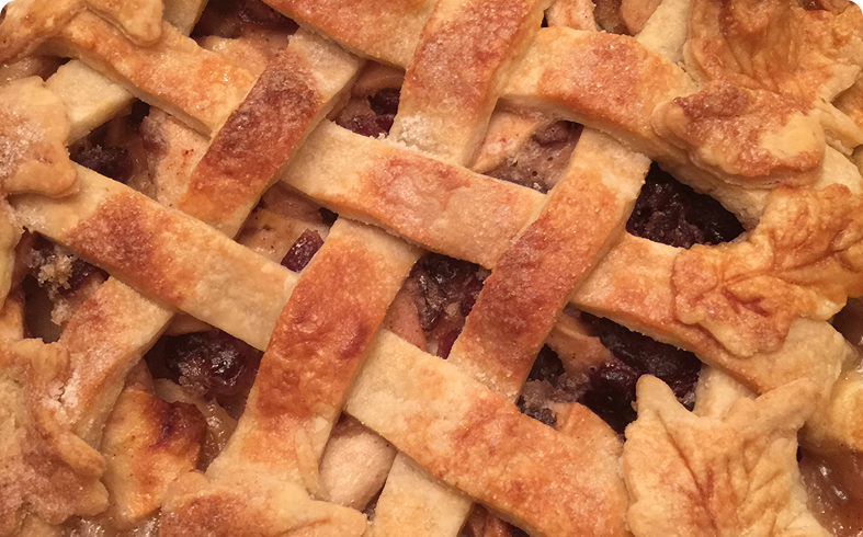 Lattice-topped pie with leaf-shaped crust.