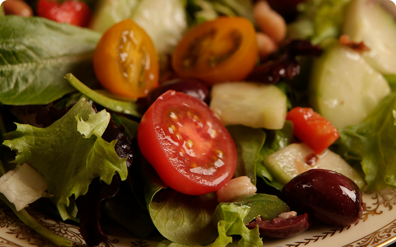 Fresh salad with tomatoes and mixed greens.